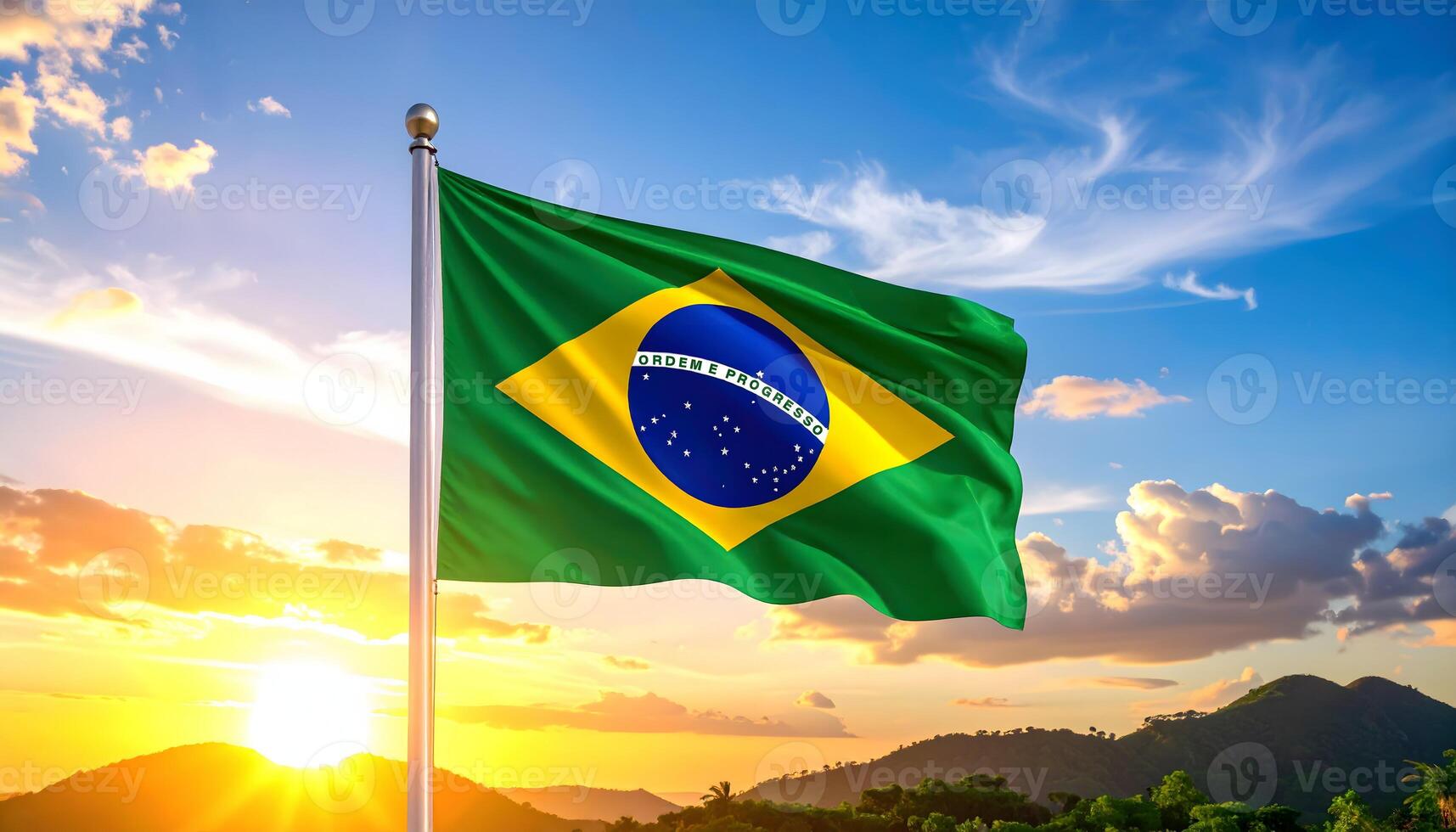 Brazilian flag waving proudly on a flagpole against a vibrant sunset sky over mountains. Features the motto Ordem e Progresso. Symbol of Brazilian patriotism, culture, and pride. photo