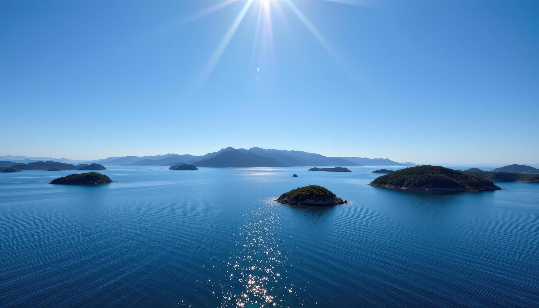 Island archipelago under a bright sun blue sea and mountains in the background Sparkling water surface photo