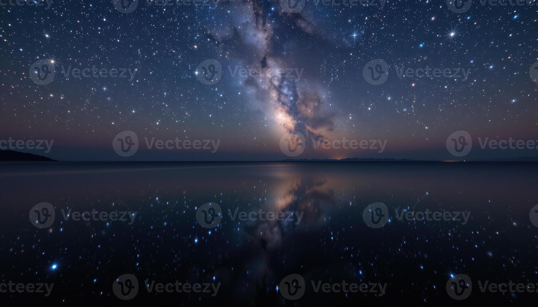 Stunning Night Sky Over Calm Water with Milky Way Reflection and Distant Starscape photo