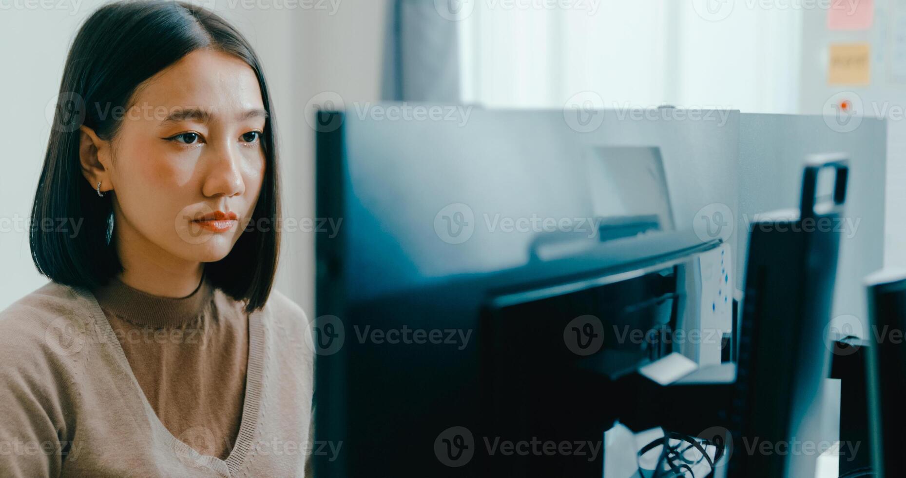 Young Asia female freelance write prompt AI bot IT app smart program nomad, game, terminal with coding language, user interface, designer, data center on desktop computer. photo