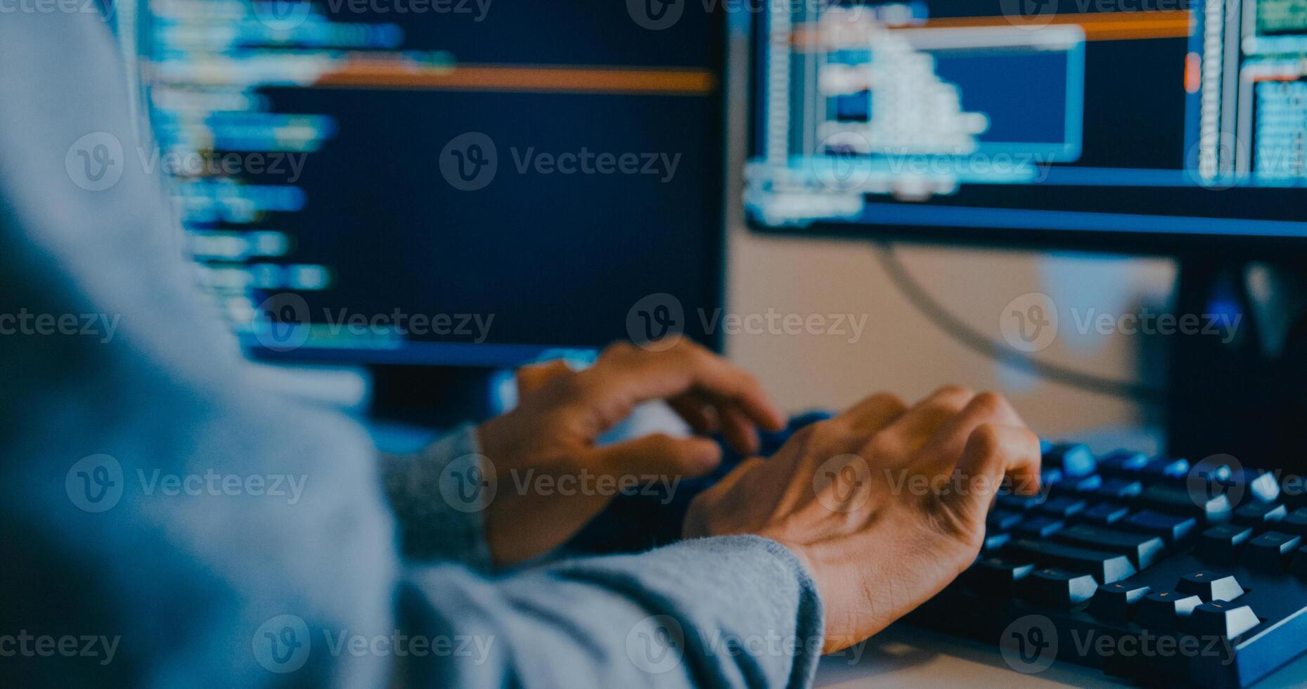 Closeup young Asia male freelance typing write prompt AI bot IT app smart program nomad, game, terminal with coding language, designer, big data center on desktop computer in night office. photo