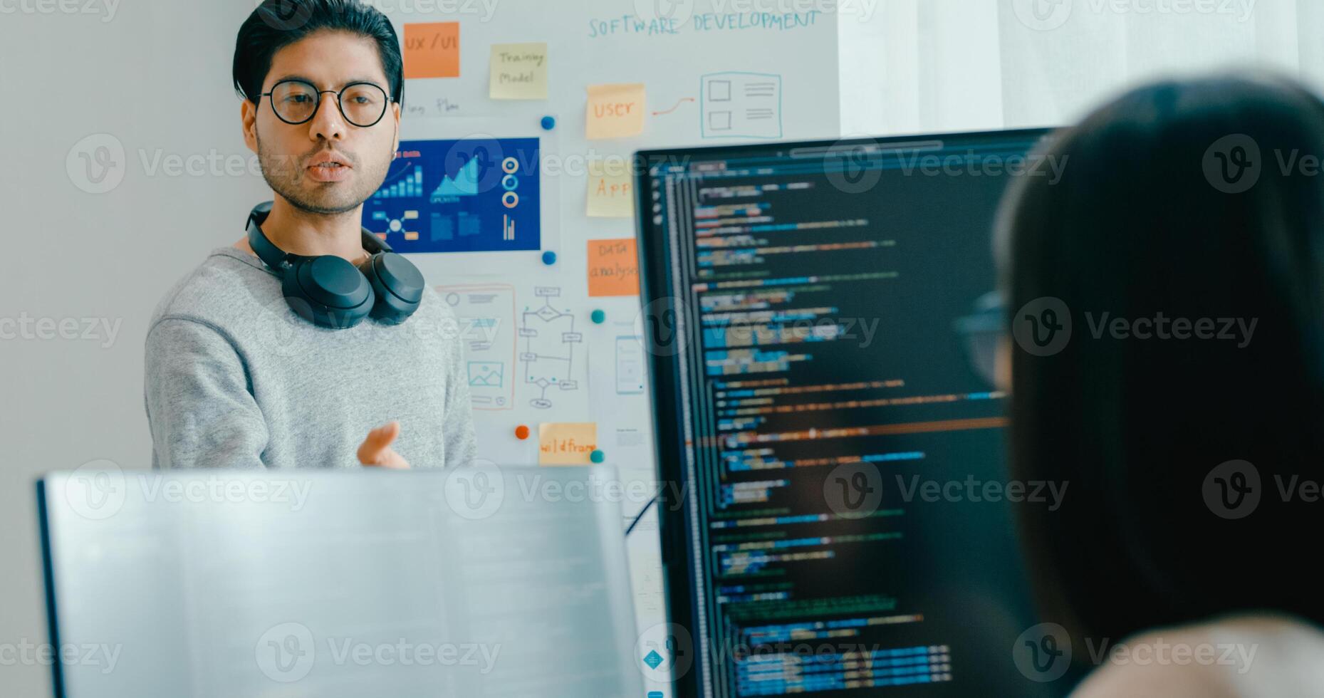 Group male female software developers mentor leader manager talk strategy plan to executive write prompt AI bot IT app program nomad, game, data center. Whiteboard slideshow code. photo