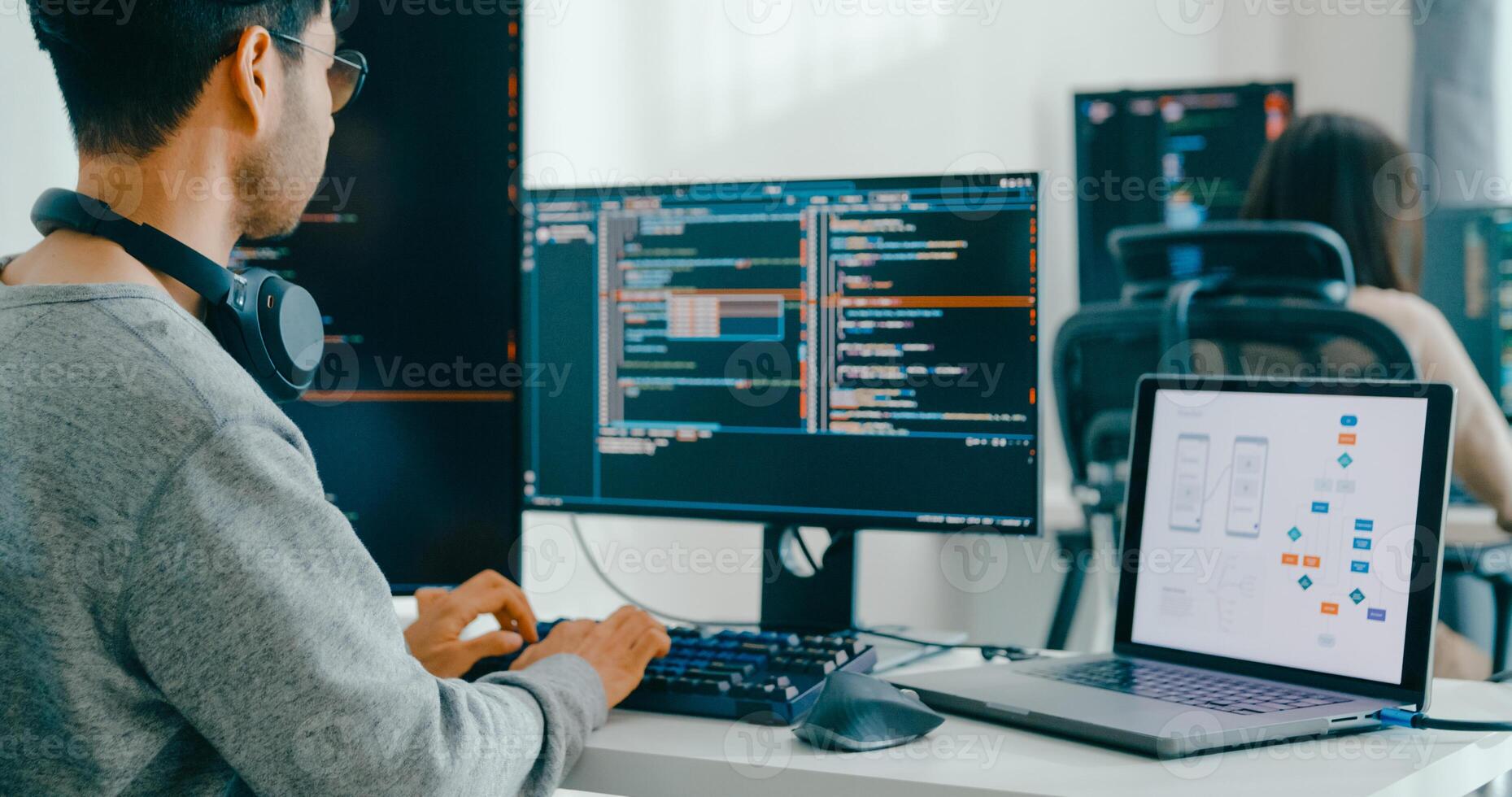 Closeup Asia male, female freelance typing write prompt AI bot IT app smart program nomad, game, terminal with coding language, user interface, designer, data center desktop computer photo