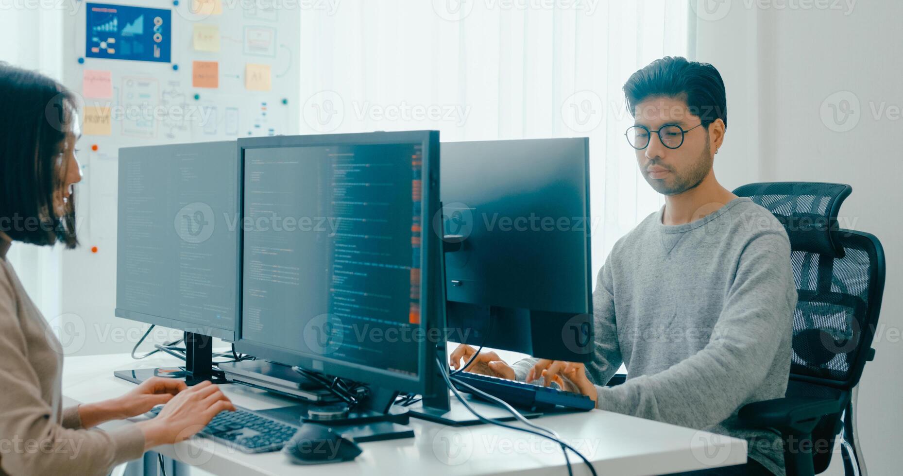 Group Adult Asia male, female freelance typing write prompt AI bot IT app smart program nomad, game, terminal with coding language, user interface, designer, big data center on desktop computer. photo