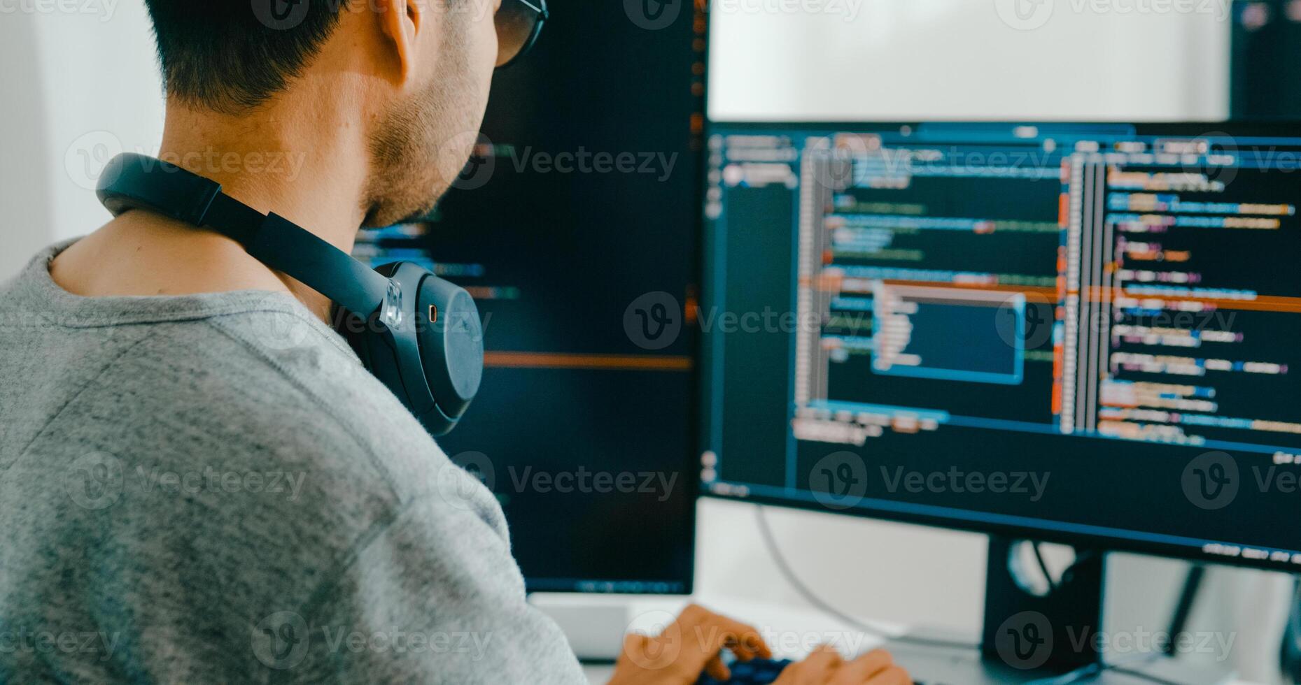 Closeup Asia male freelance typing write prompt AI bot IT app smart program nomad, game, terminal with coding language, user interface, designer, big data center desktop computer. photo