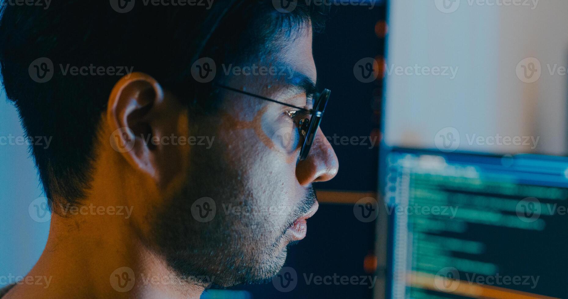 Closeup Asia male freelance typing write prompt AI bot IT app smart program nomad, game, terminal with coding language, designer, big data center on desktop computer in night office. photo