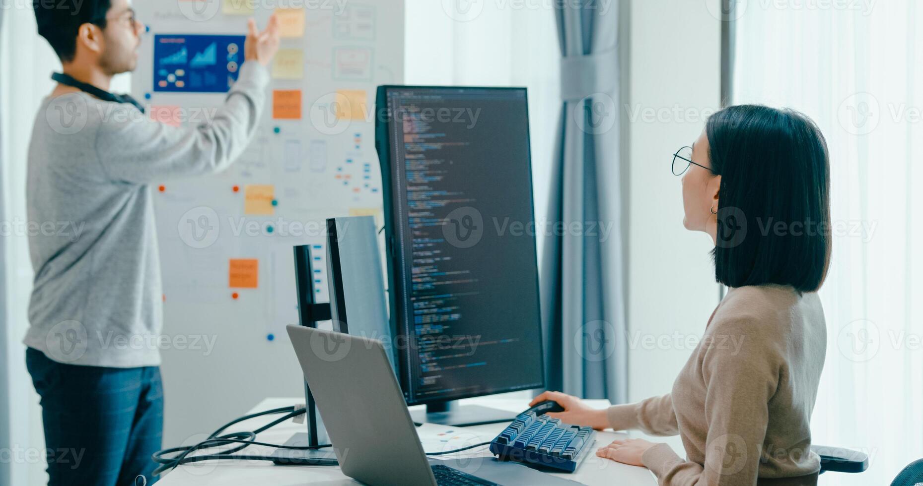 Group Asia male female software developers mentor leader manager talk strategy plan to executive write prompt AI bot IT app program nomad, data center. Whiteboard code photo