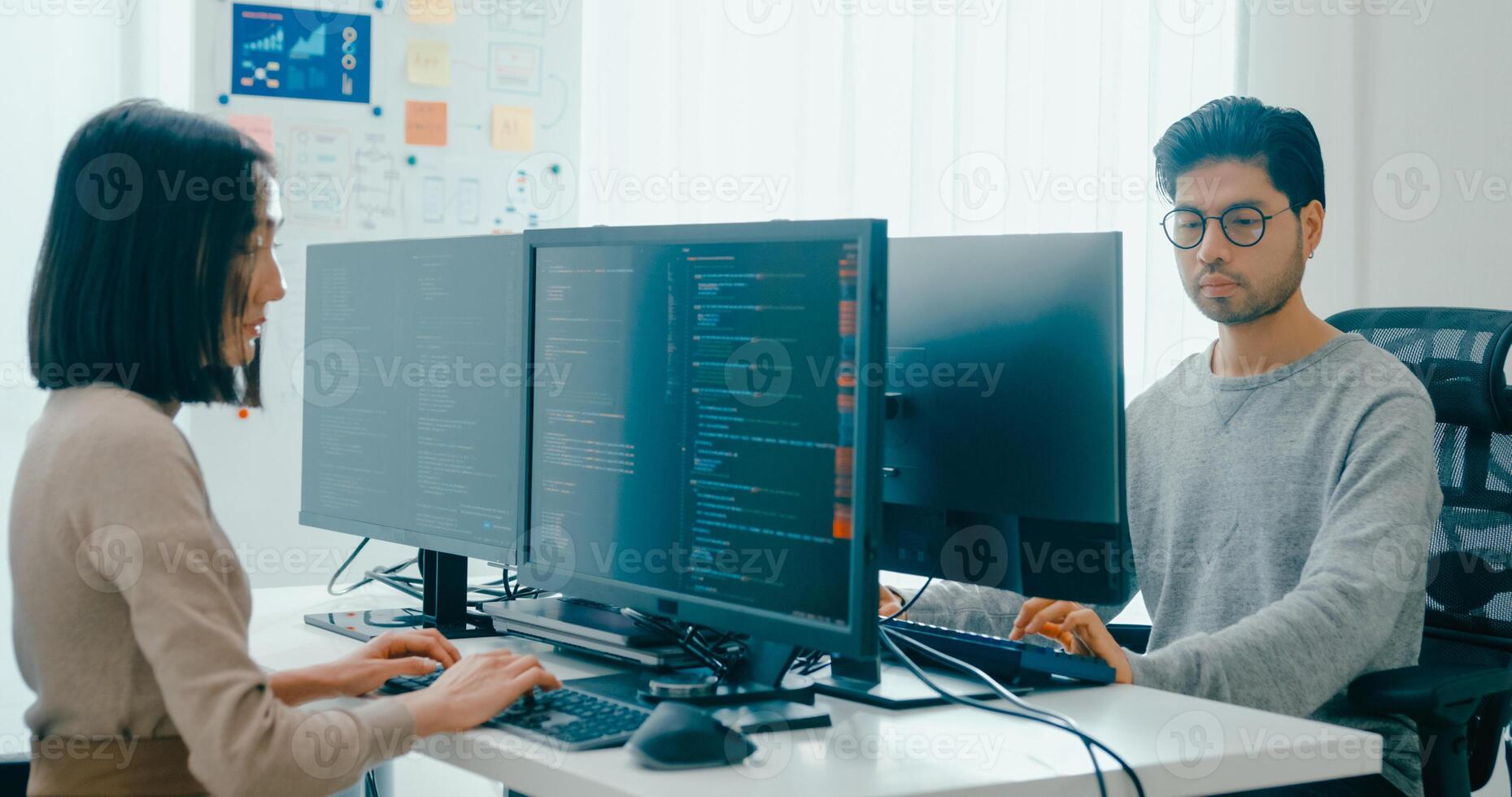 Group Asia male, female freelance typing write prompt AI bot IT app smart program nomad, game, terminal with coding language, user interface, designer, big data center on desktop computer. photo