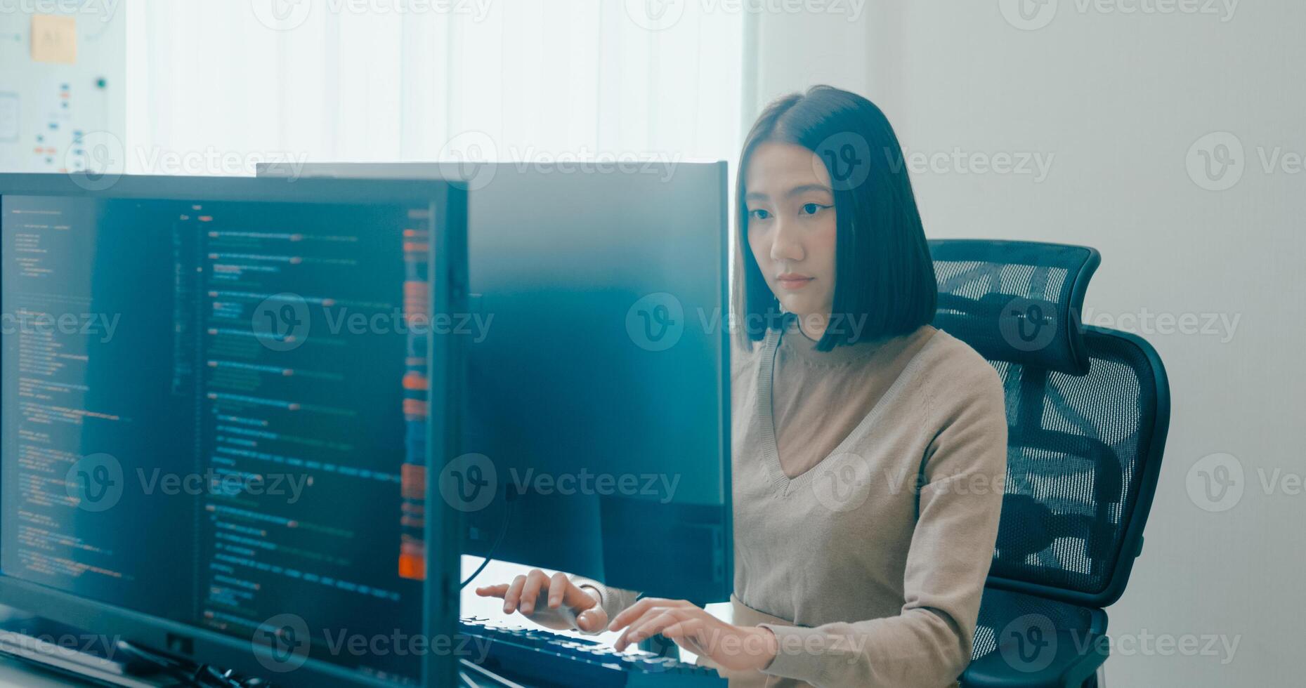 Young Asia female freelance write prompt AI bot app smart program nomad, game, terminal with coding language, user interface, designer, big data center on desktop computer. photo