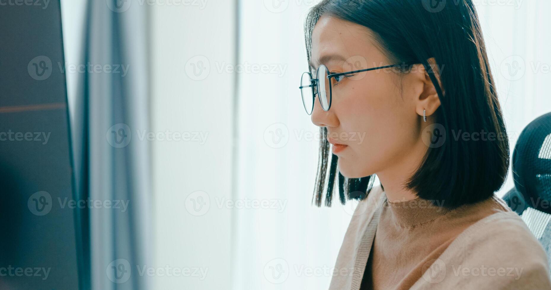 Closeup Asia female freelance eyeglasses typing write prompt AI bot IT app program nomad, game, terminal with coding, user interface, designer, big data center on desktop computer. photo