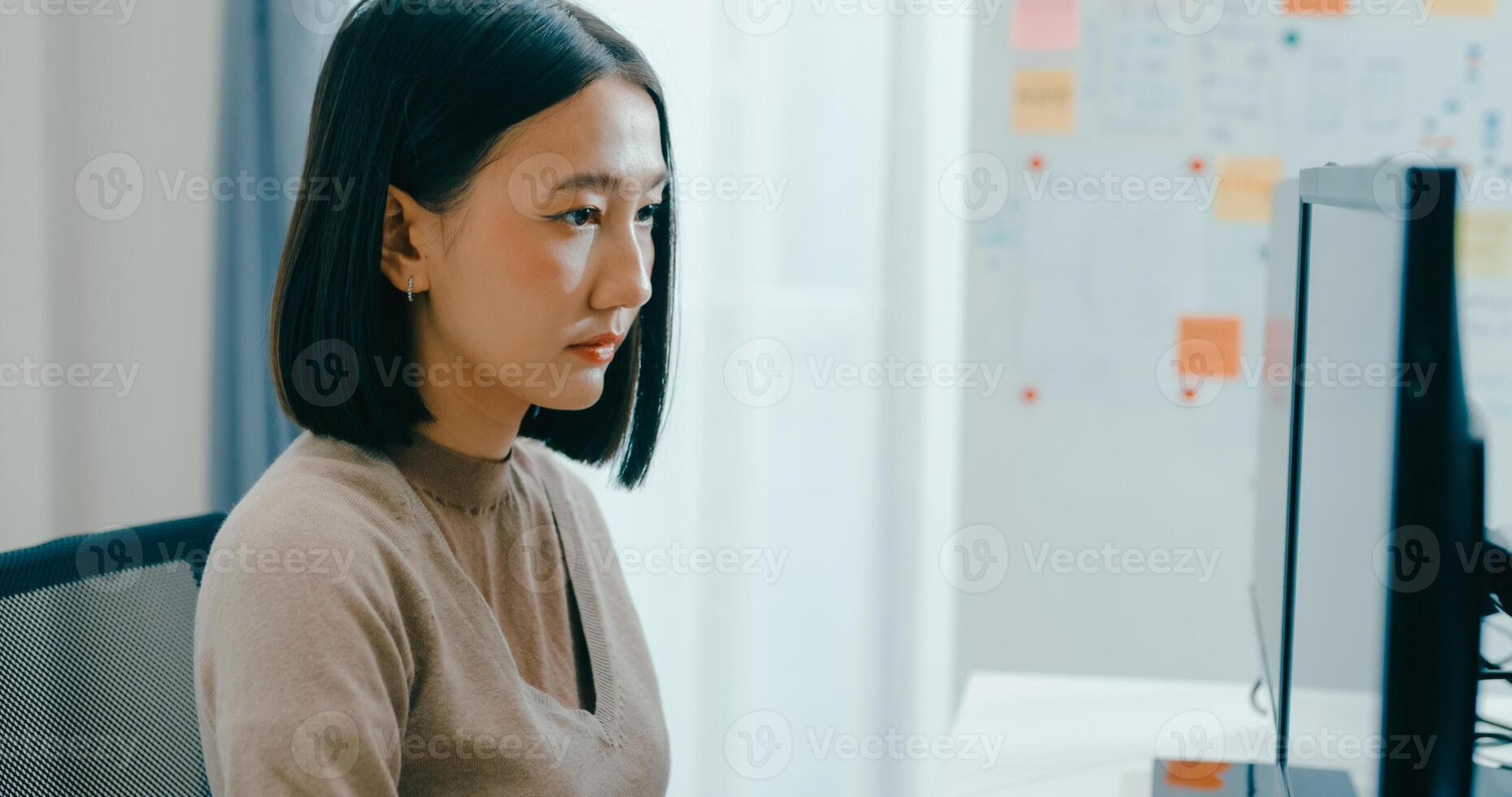 Young Asia female freelance write prompt AI bot IT app smart program nomad, game, terminal with coding language, user interface, designer, big data center on desktop computer. photo