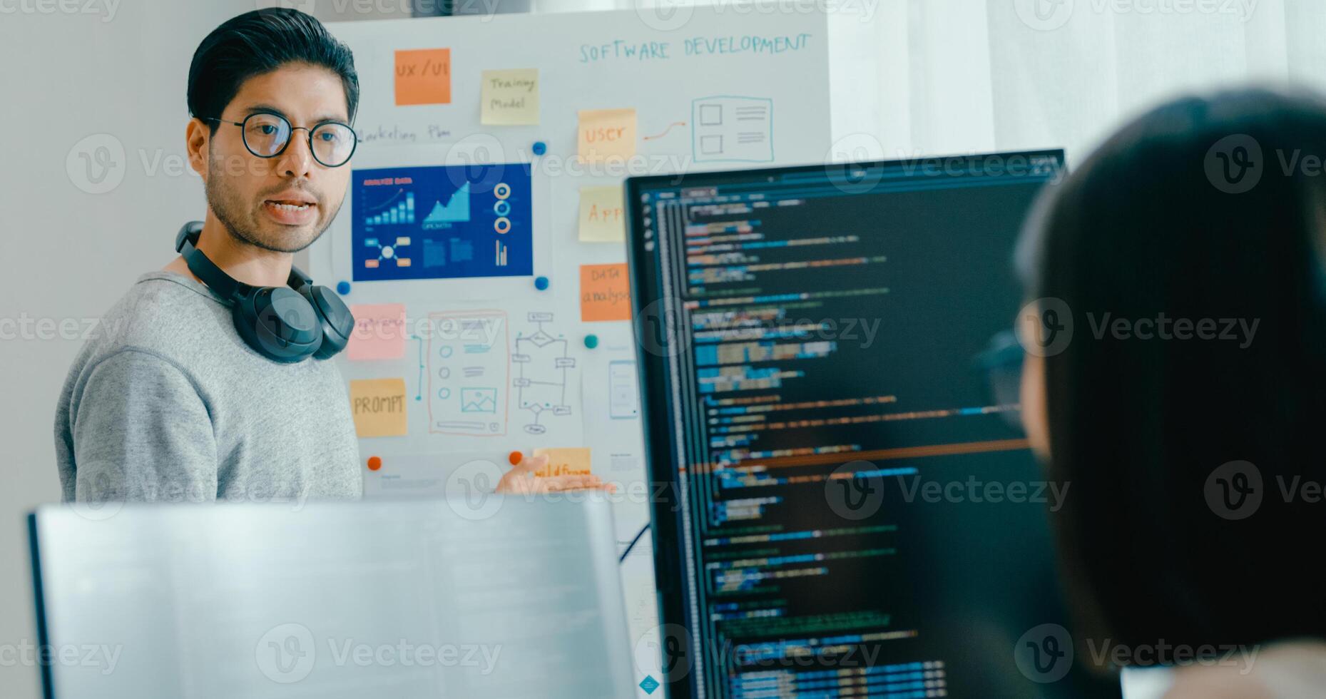 adult Asia male female software developers mentor leader manager talk strategy plan to executive write prompt AI bot IT app program nomad, game, data center. Whiteboard slideshow code photo