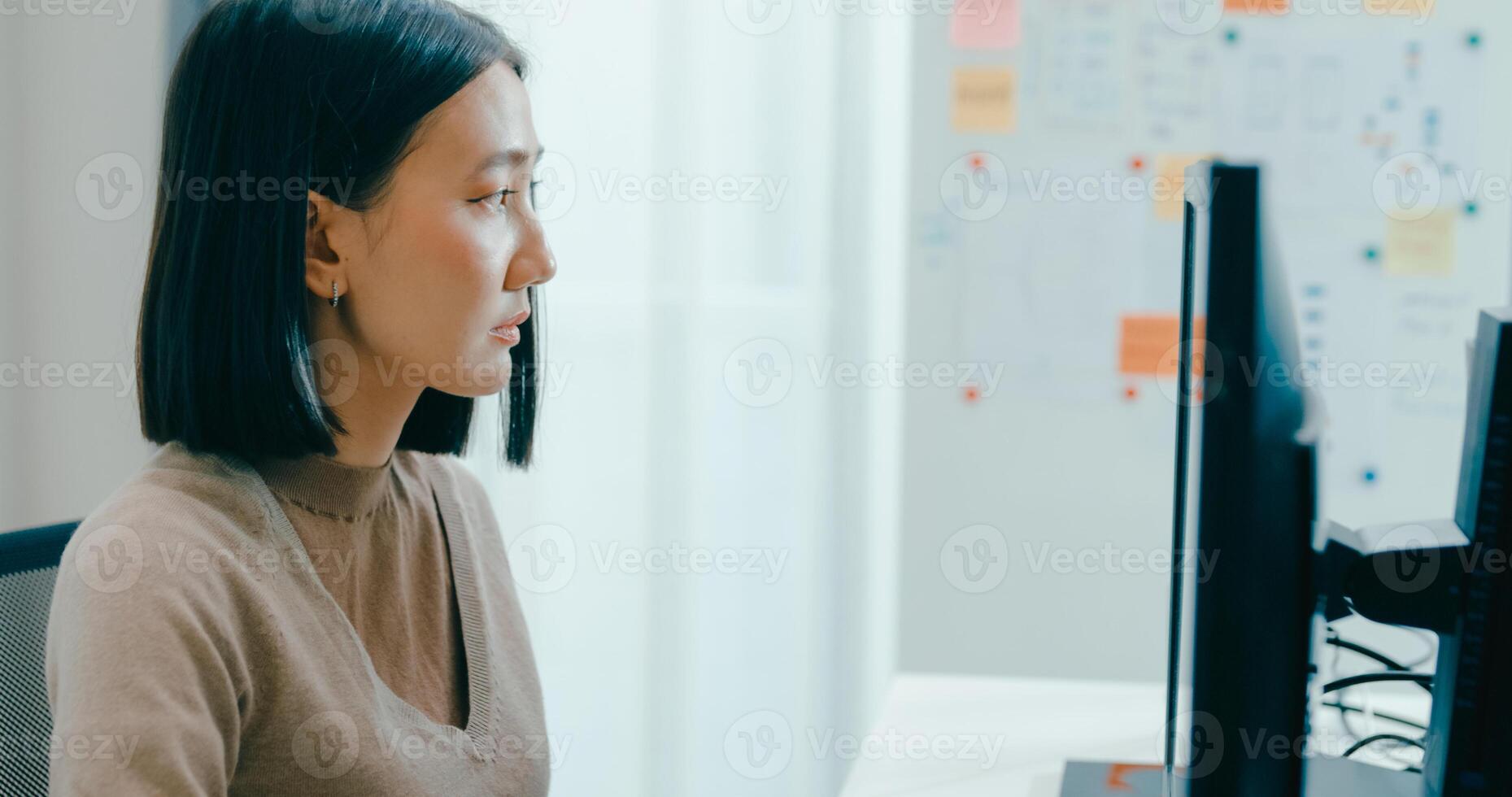 Young Asia female freelance typing write prompt AI bot IT app smart program nomad, game, terminal with coding language, user interface, designer, big data center on desktop computer photo