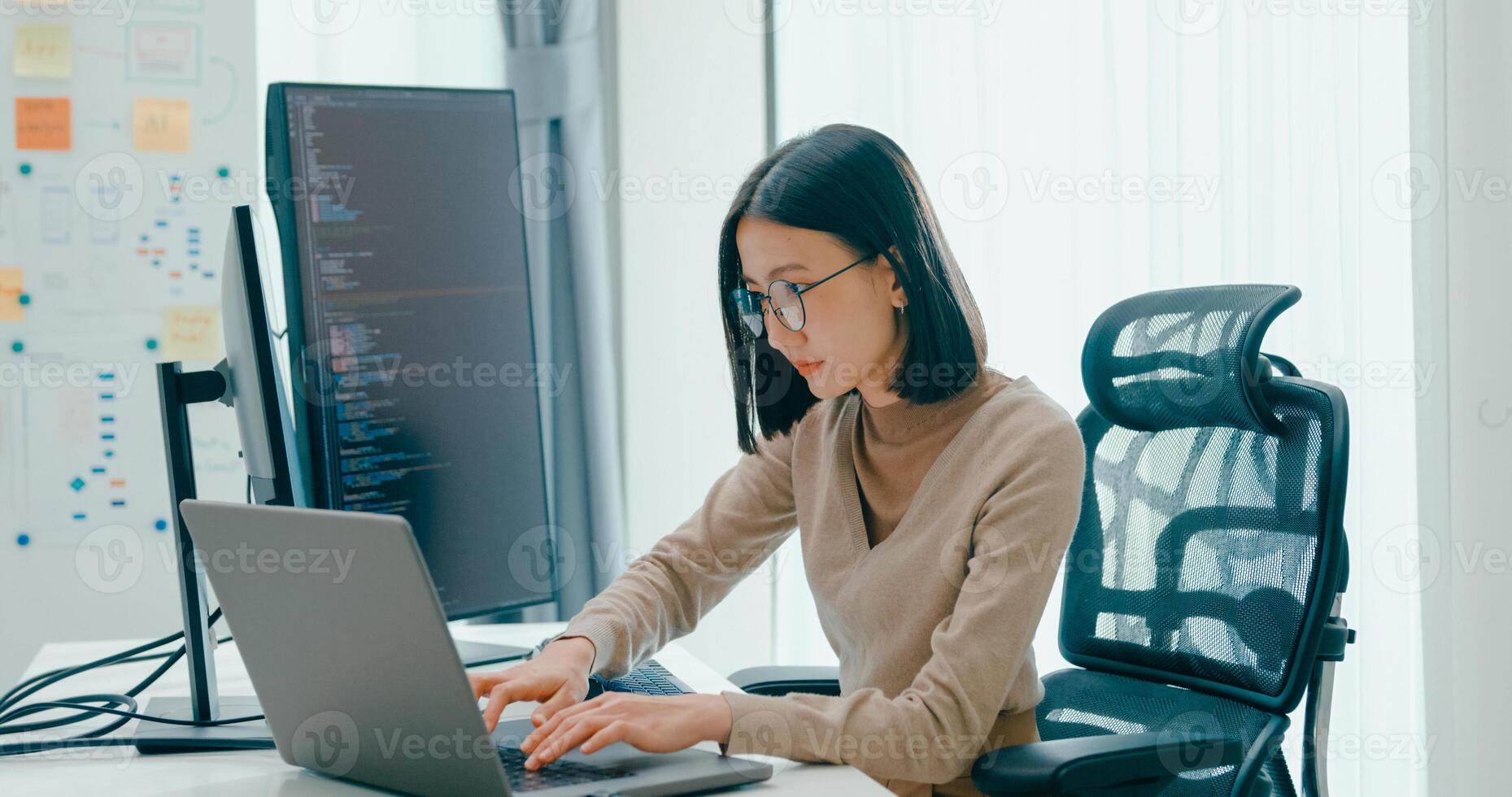 Young adult Asia female typing write prompt AI bot IT app smart program nomad, game, terminal with coding, user interface, designer, big data center on desktop computer. photo