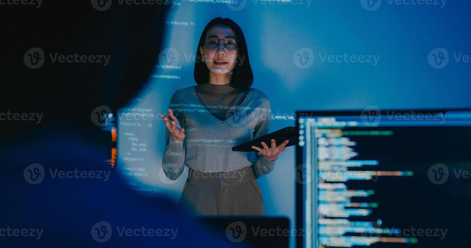 adult Asia female software developer mentor leader manager talk strategy plan to executive write prompt AI bot IT app program nomad, game, designer, data center. Projecting slideshow code. photo