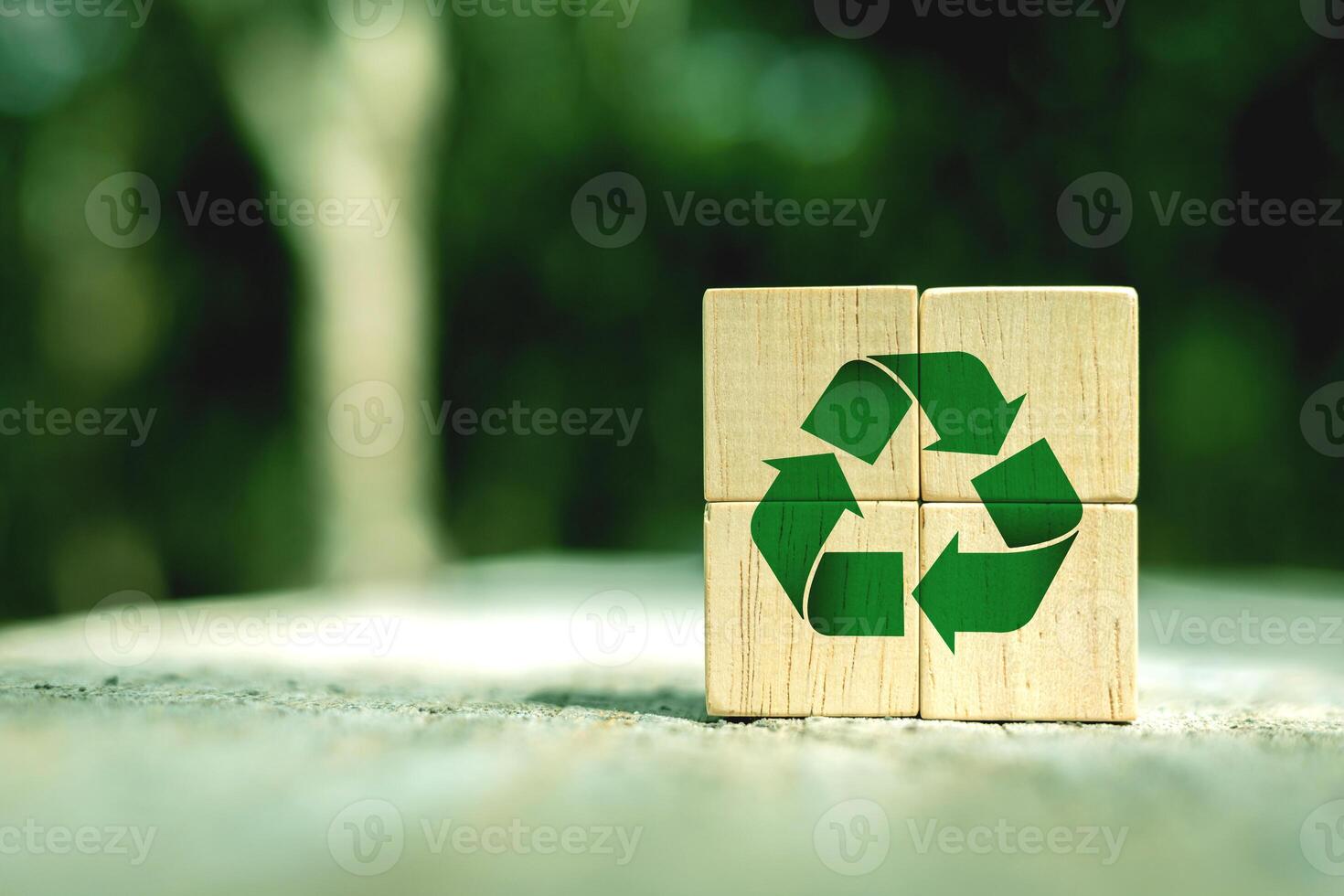 Green Recycling Symbol on wooden block. Concepts of reducing and reusing, environmentally friendly products, CSR, zero waste. with copy space photo