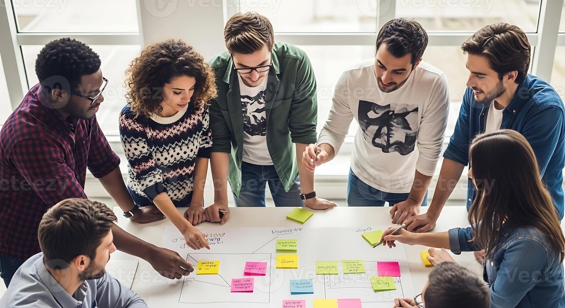 A group of people around a table with sticky notes photo