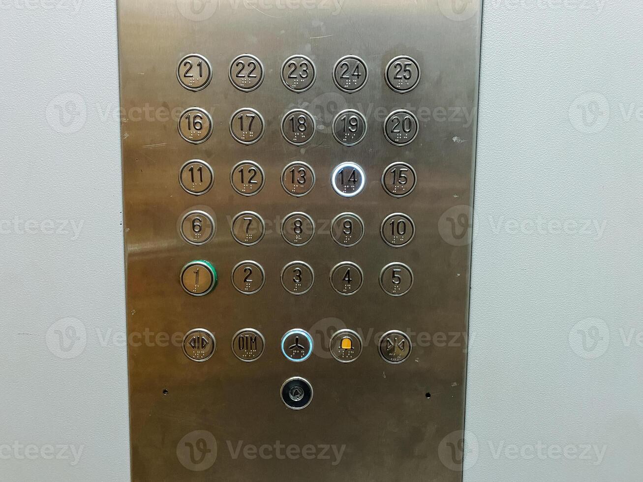 A highly polished stainless steel elevator control panel that features clearly labeled buttons corresponding to the numbers 1 through 12, providing easy access to various floors photo