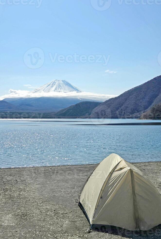 Vertical camping tent, outdoor park, mount Fuji mountain in Japan countryside photo