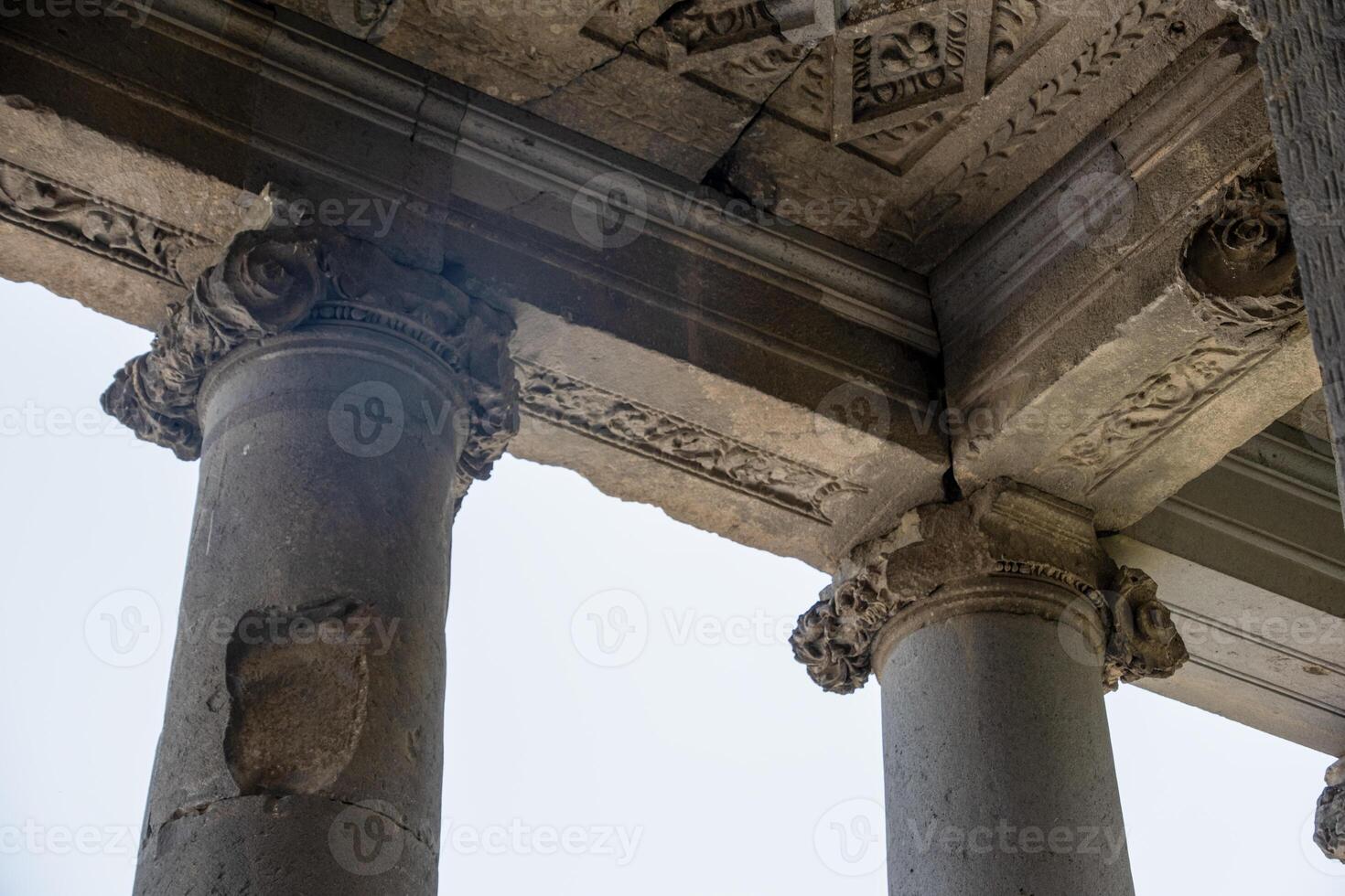 columns of an ancient temple, view from below photo