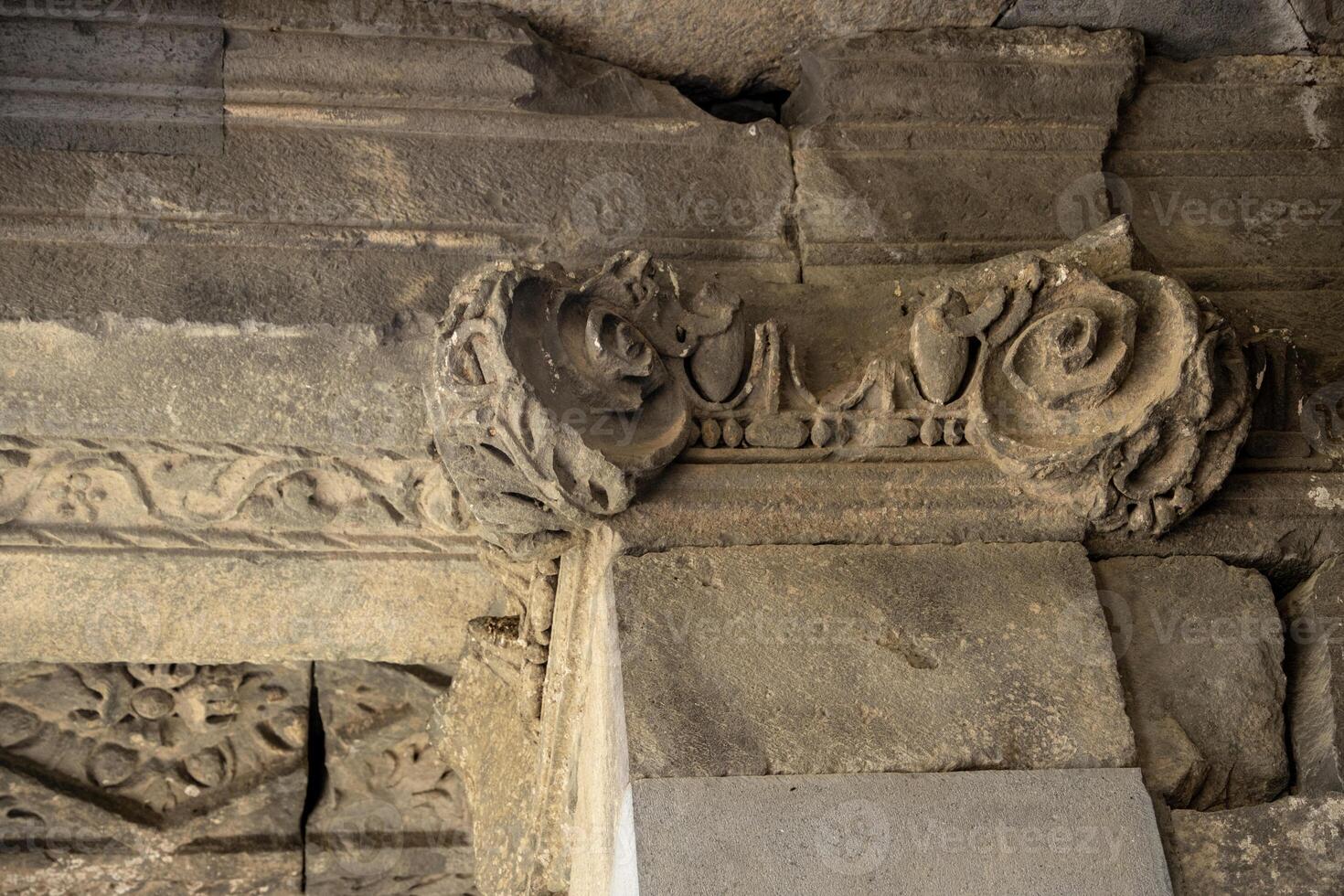 Fragment of a columned ancient temple with stucco, Garni, Armenia. photo