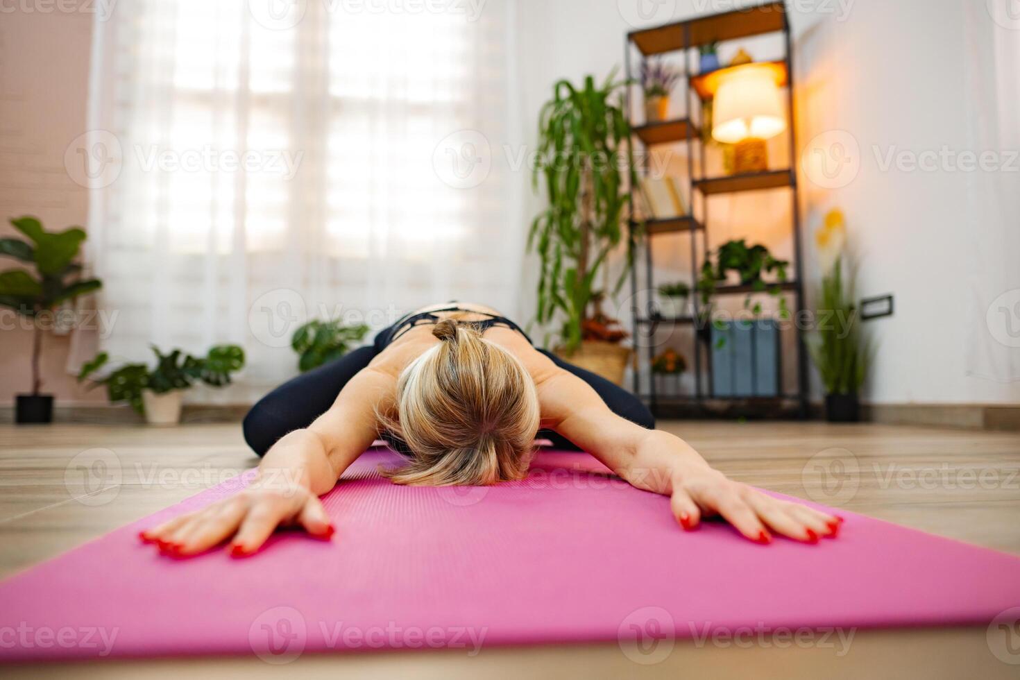 Engaging in relaxed yoga practice during a calming indoor session photo