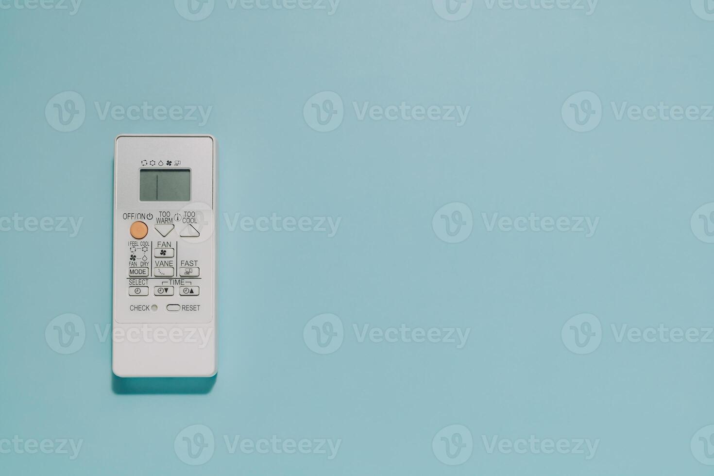White Air Conditioner Remote Control on Blue Background, Climate Comfort photo