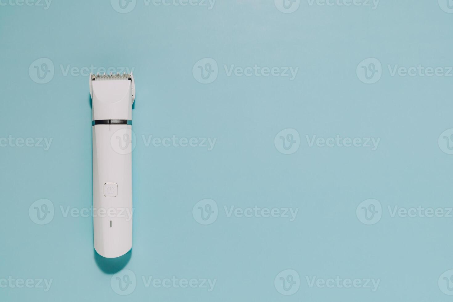 Modern White Hair Clipper on Blue, Grooming and Self Care Tool photo