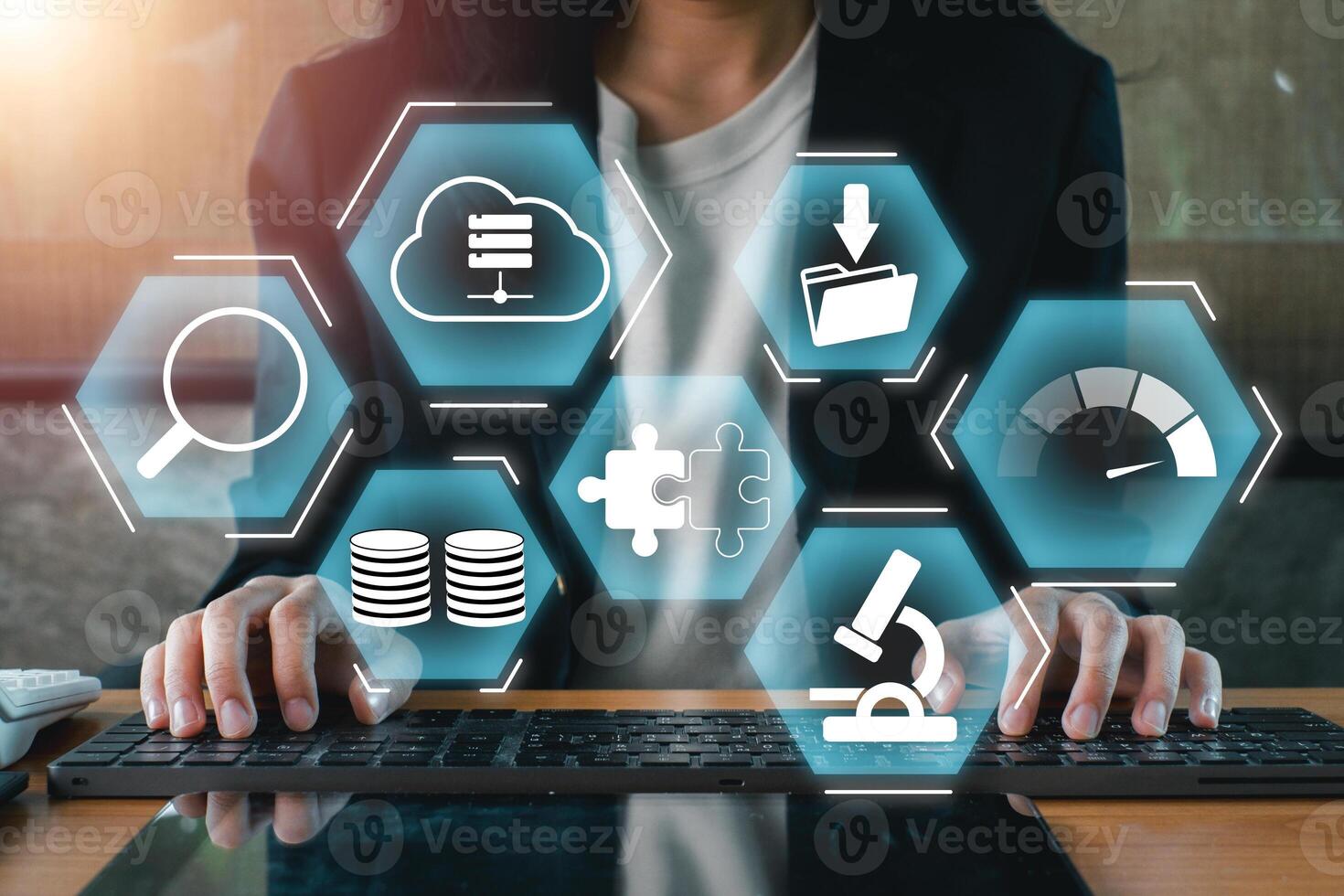 Businesswoman interacting with digital icons representing big data, analytics, and cloud computing on a futuristic interface. photo