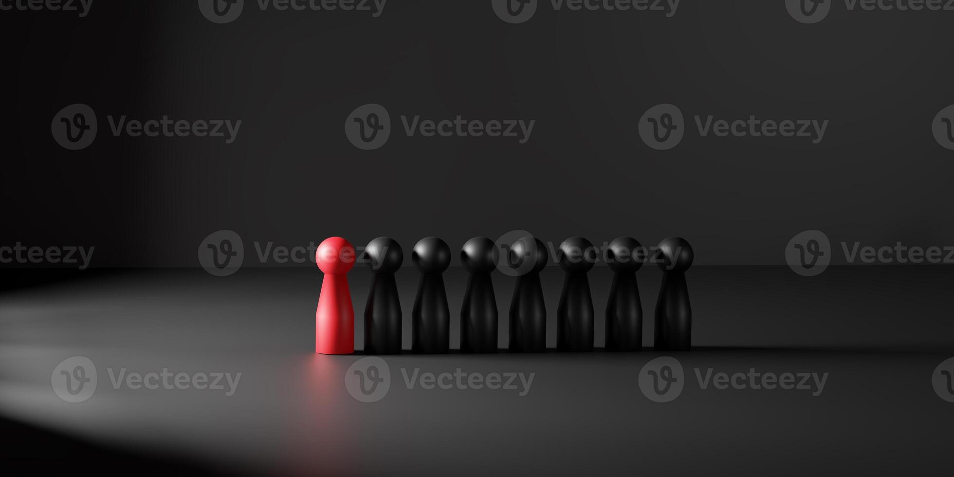 Leadership is symbolized by a red doll illuminated in a spotlight among black ones. This 3D render conveys individuality, standing out in business, and personal development. photo