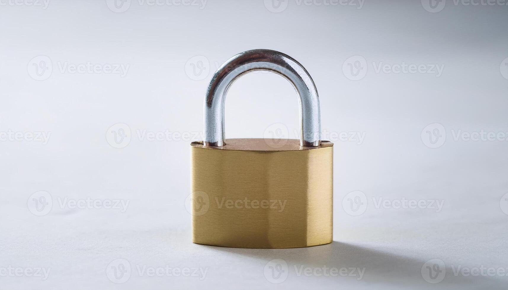 Golden padlock on light backdrop. Security, safety and protection concept. photo