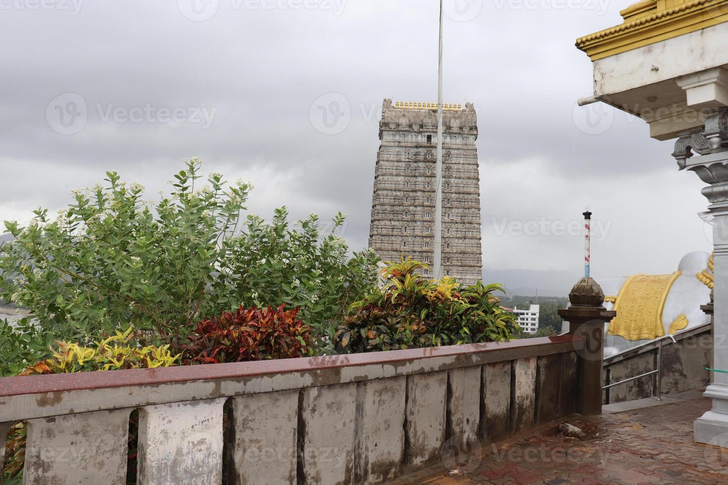 A white building with a yellow roof photo