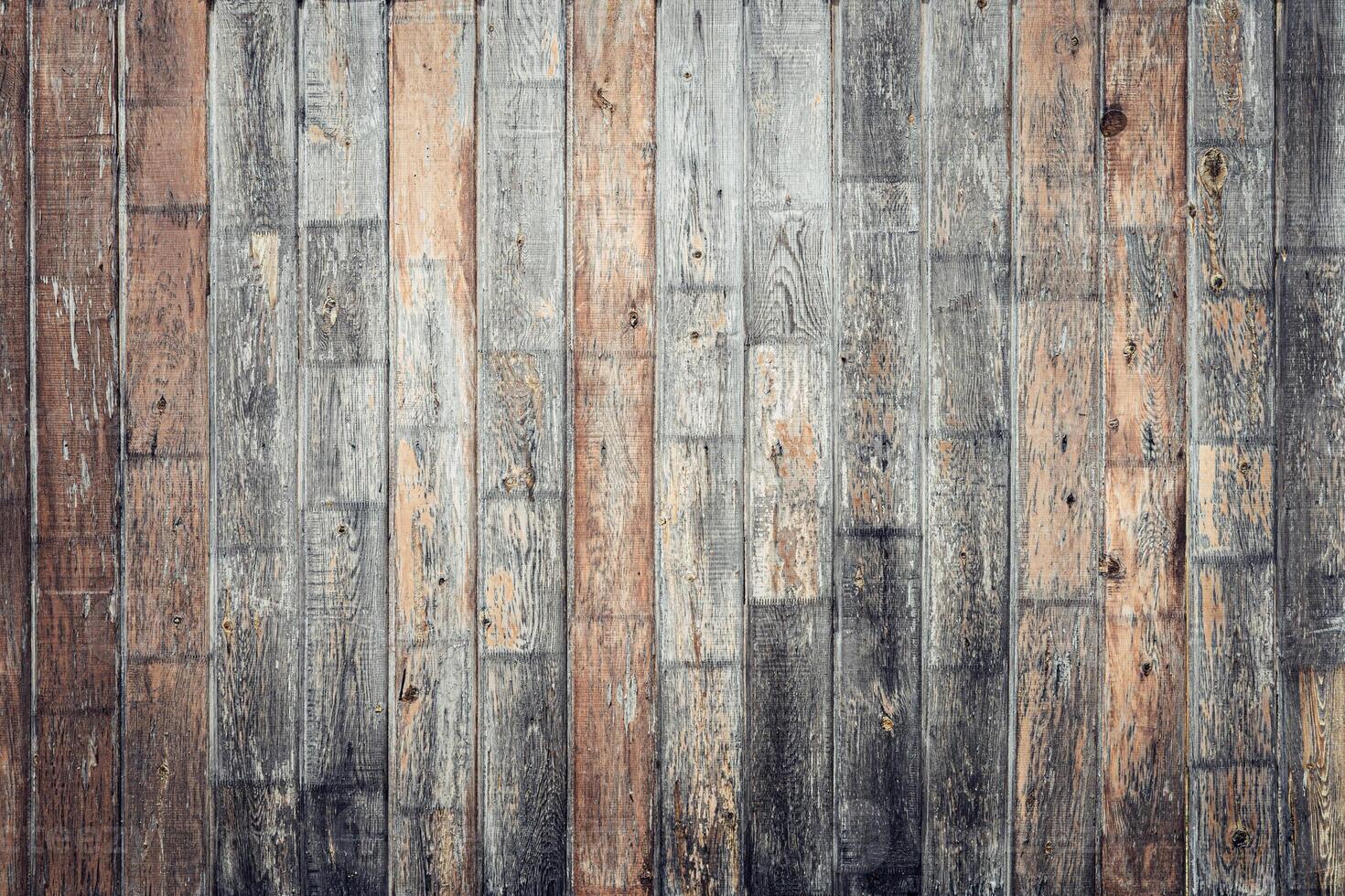 textured wooden wall with varying shades of brown and gray. The planks are arranged horizontally, showcasing natural wood grain and imperfections photo