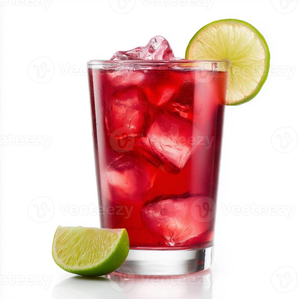 Cranberry juice with ice and lime wedge served in a clear glass on a bright background photo