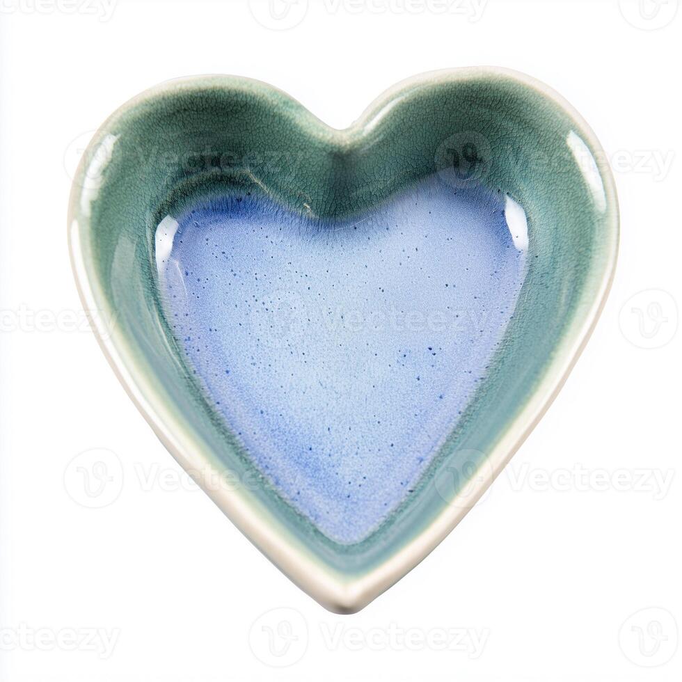 Ceramic love heart trinket dish isolated on white background perfect for gifts and home decor photo