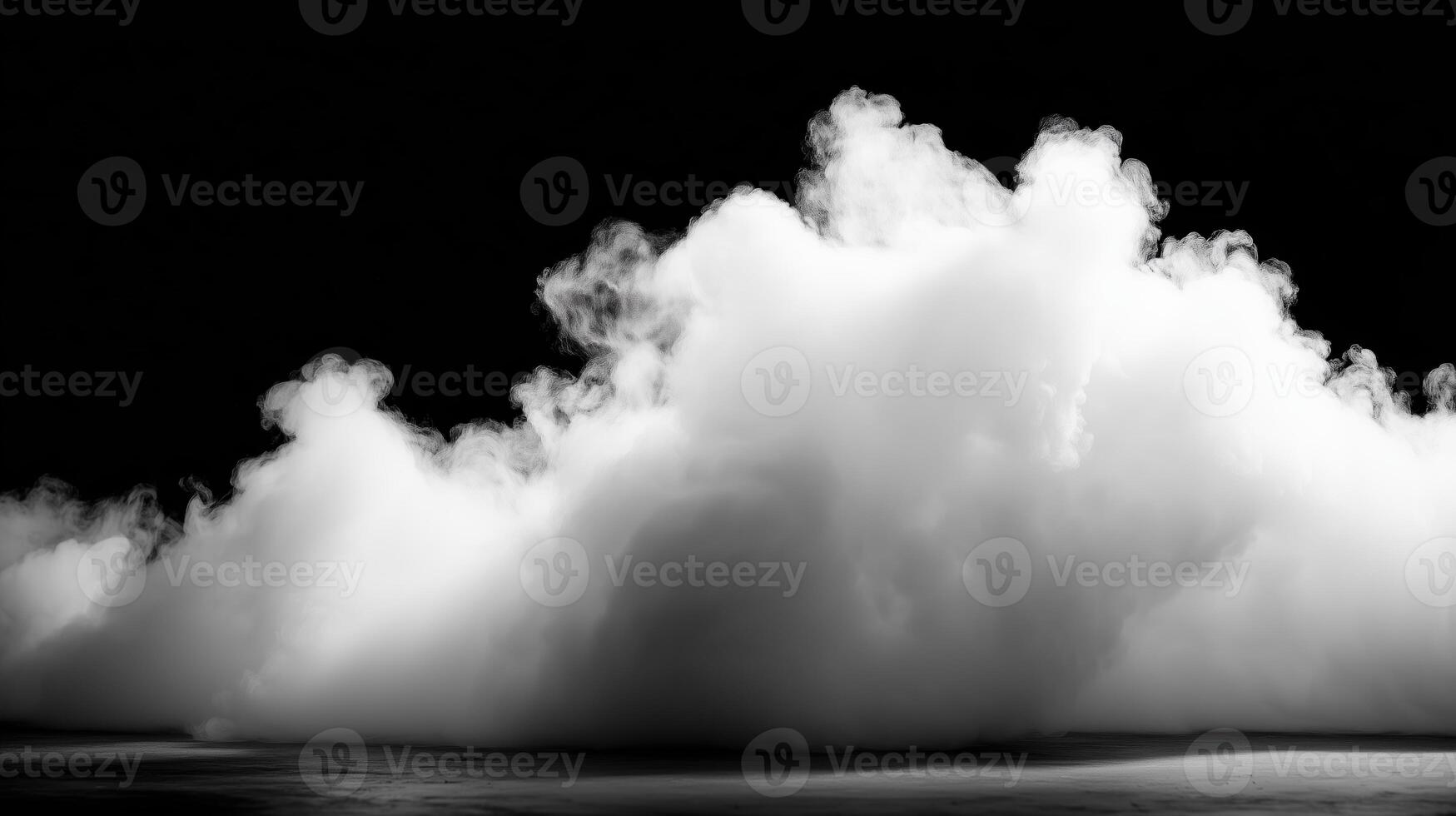 A thick cloud of white smoke sits on a dark stage, perfect for atmospheric backgrounds photo