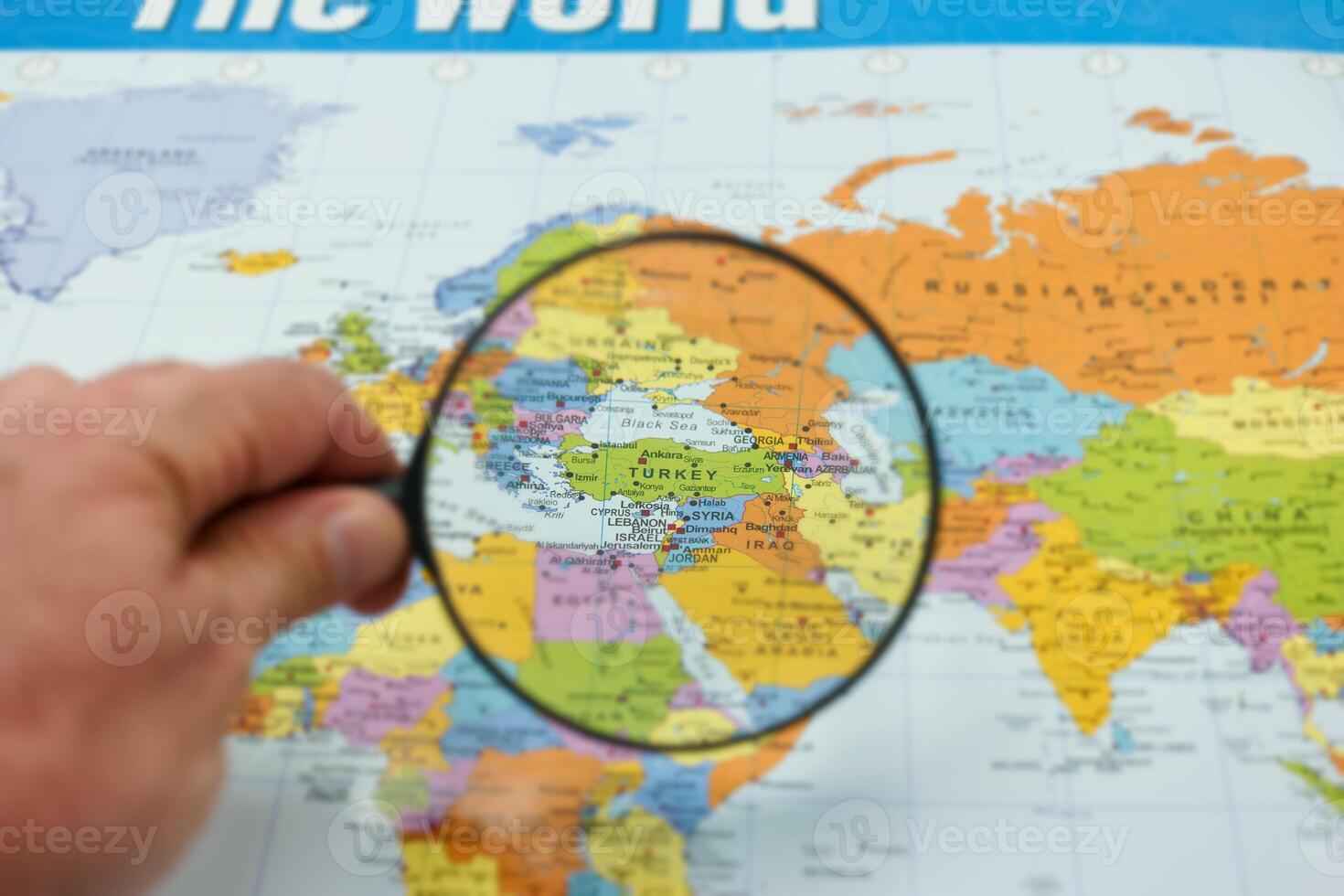 Exploring turkey on a world map with a magnifying glass for detailed insight into geography photo