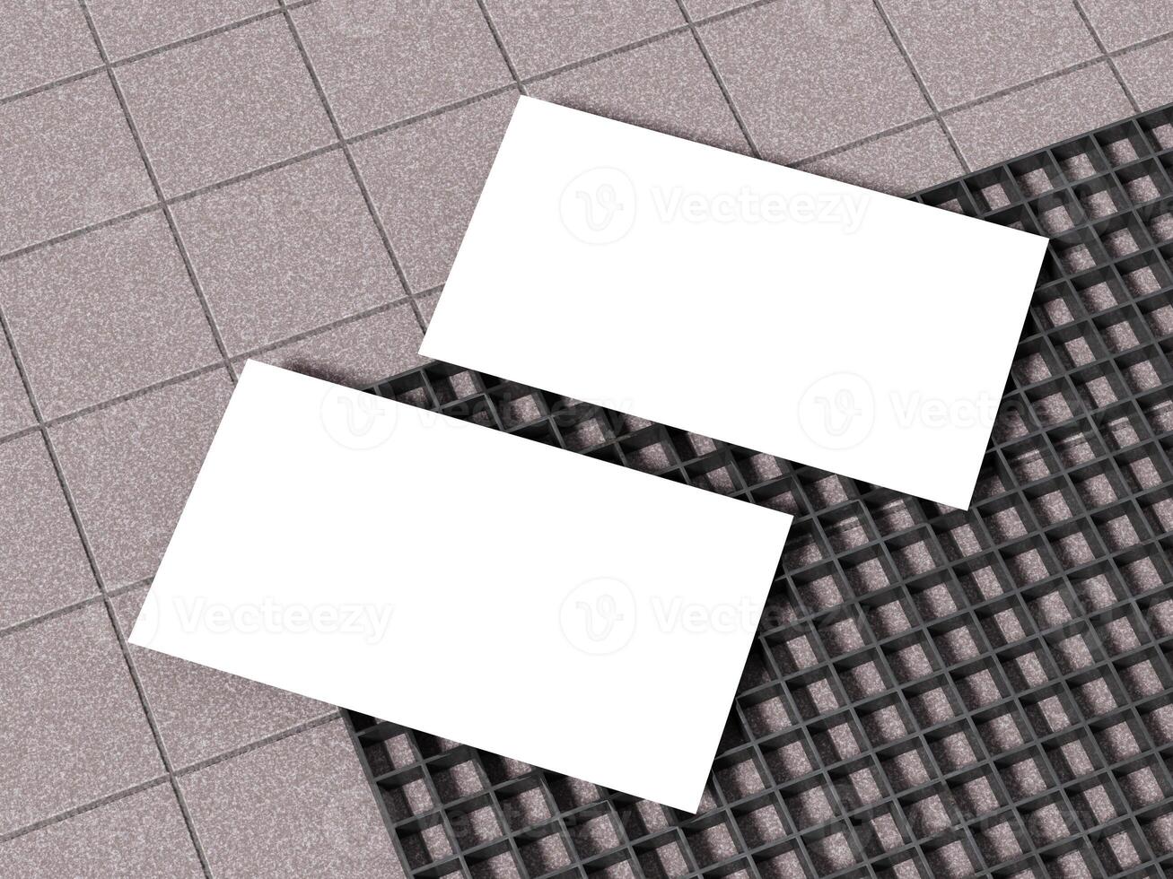 White business card mockup on a grid-like concrete surface. photo
