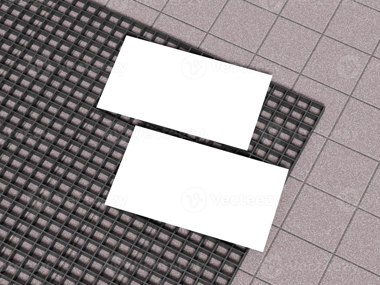 White business cards placed on a concrete grid pattern surface. photo