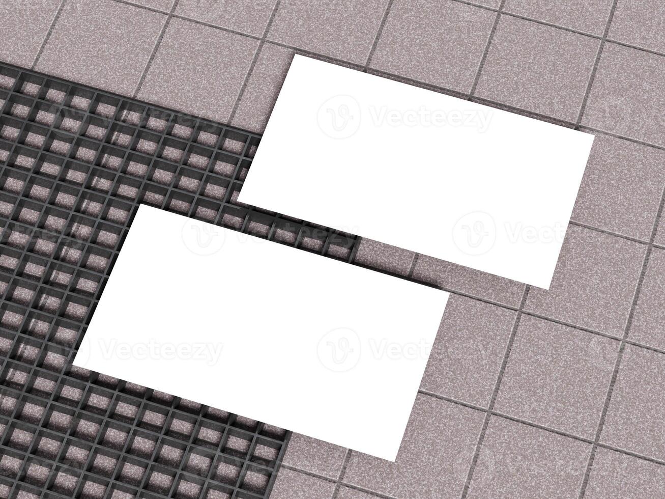 Two business cards on a grid pattern concrete floor background. photo
