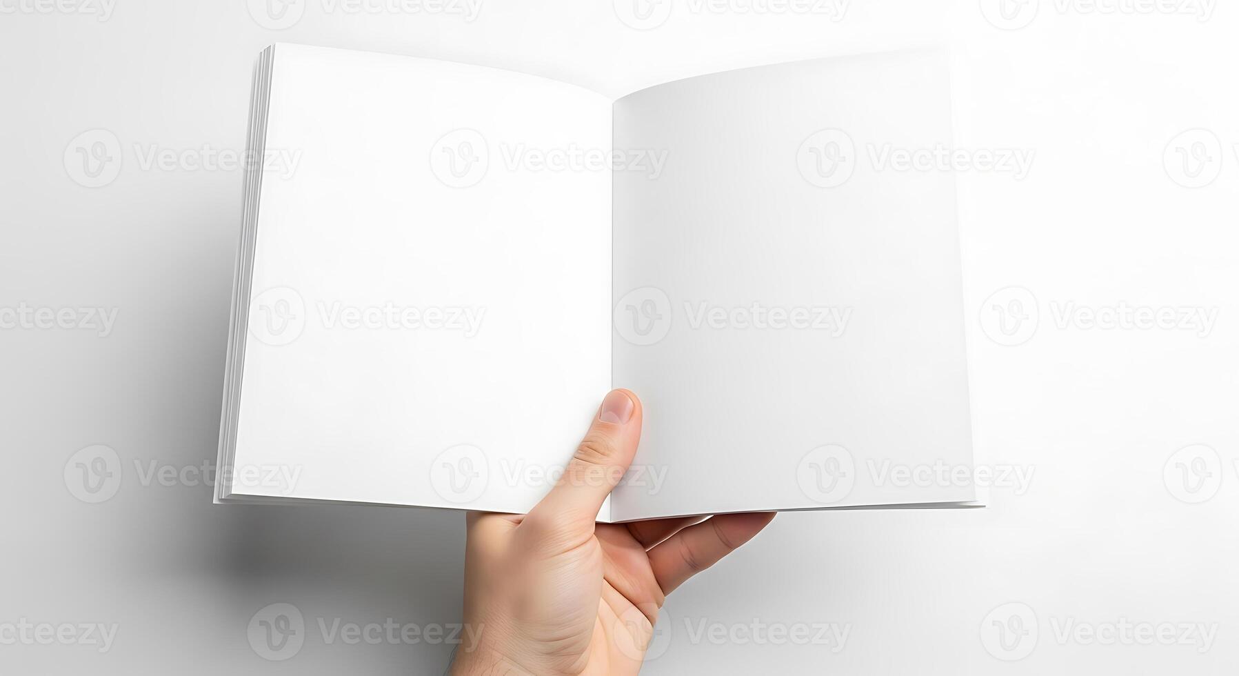 Open Book Being Held by Hand on White Background photo