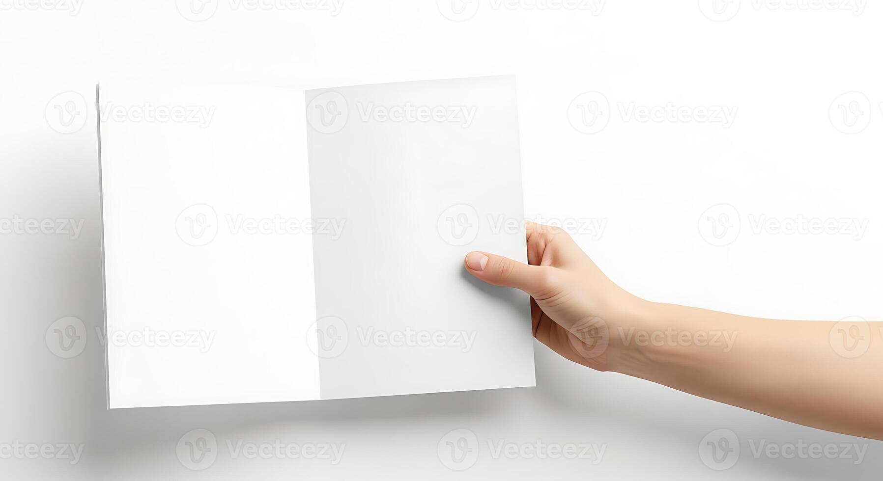 Open Brochure Held by Hand on White Background photo