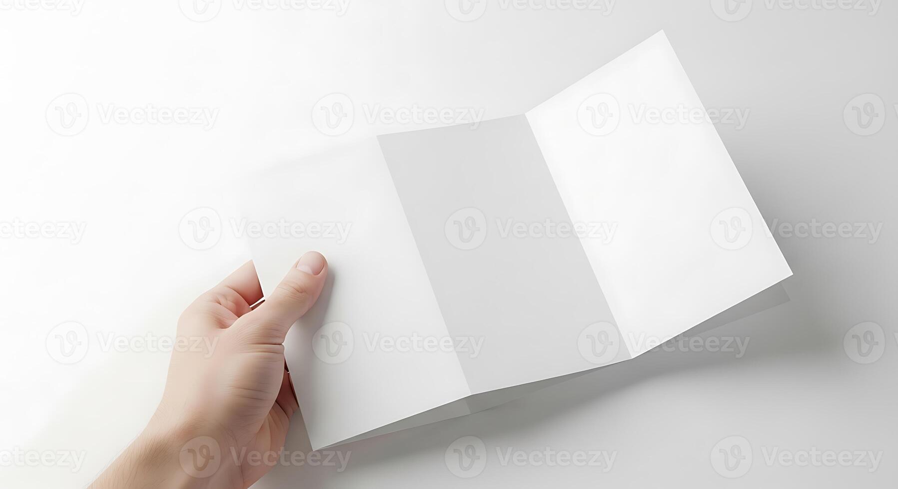 Blank Trifold Brochure Held by Hand photo