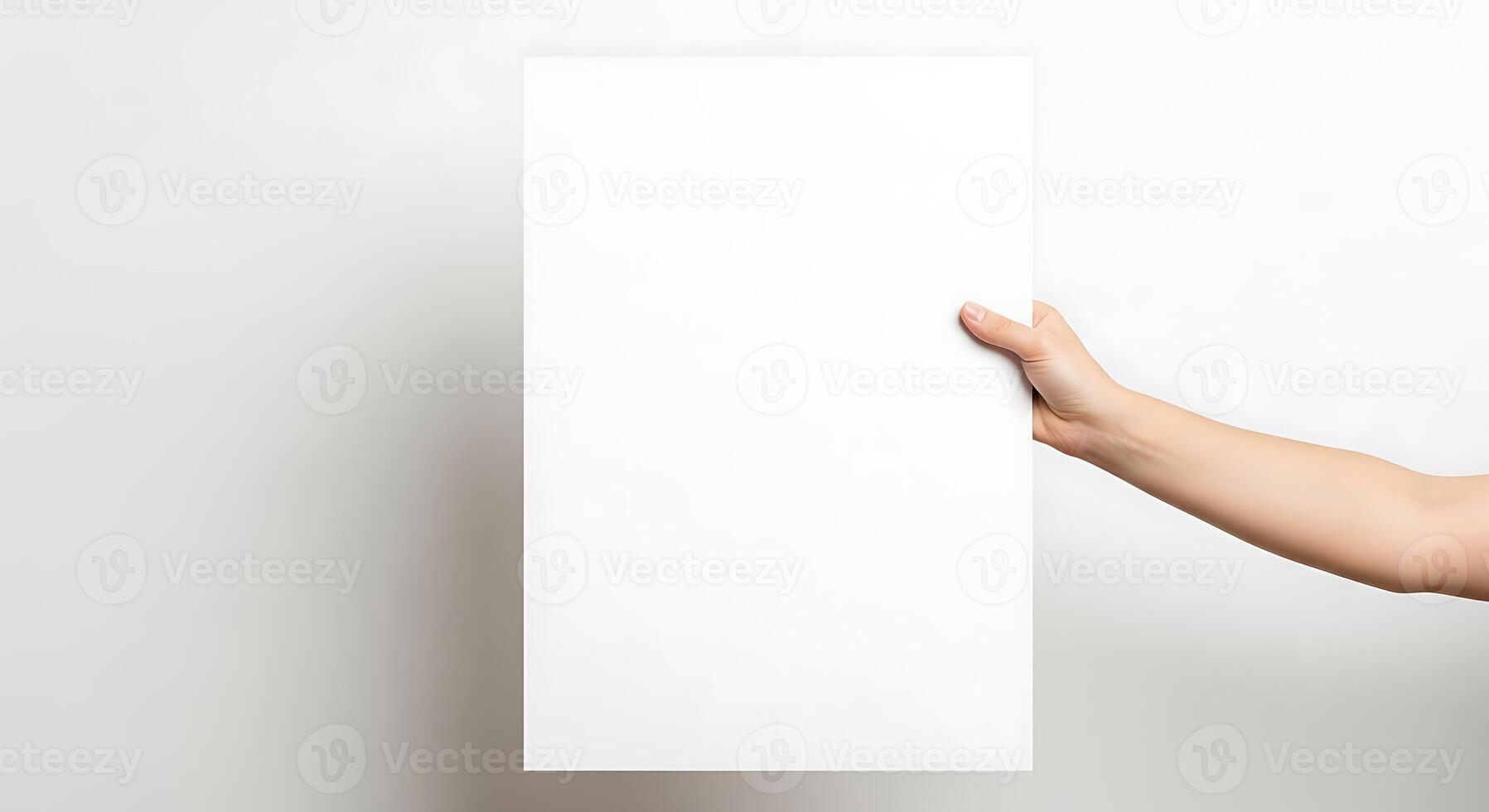 Blank White Sheet Hand Holding Mockup photo