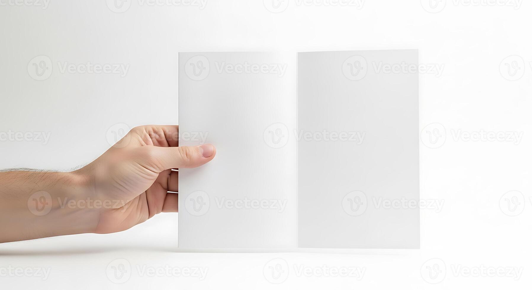 Blank Paper Sheet Held in Hand on White Background photo