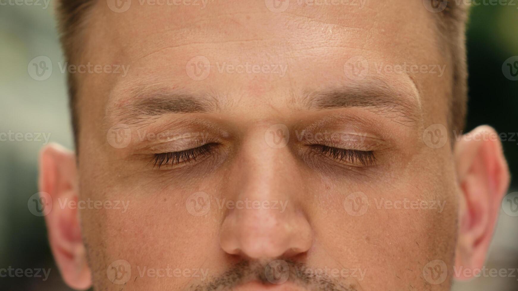 Eyes close up closed human Caucasian man cropped view eyesight guy close eye outdoors clear vision health laser correction medicine gaze blink face skin care male calm serene portrait in city outside photo