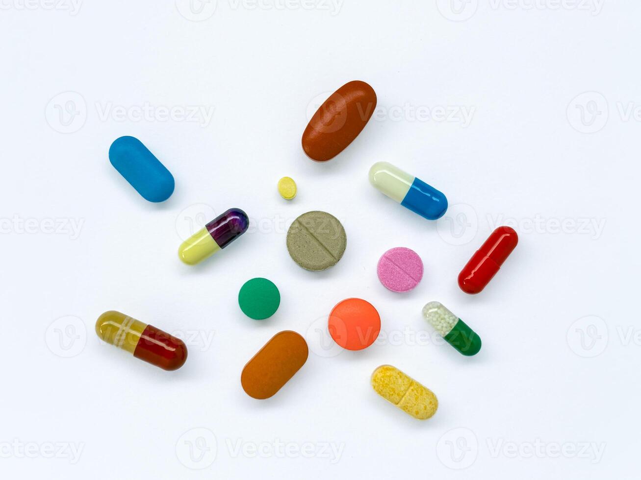 Colorful Capsules and Tablets on White Background photo