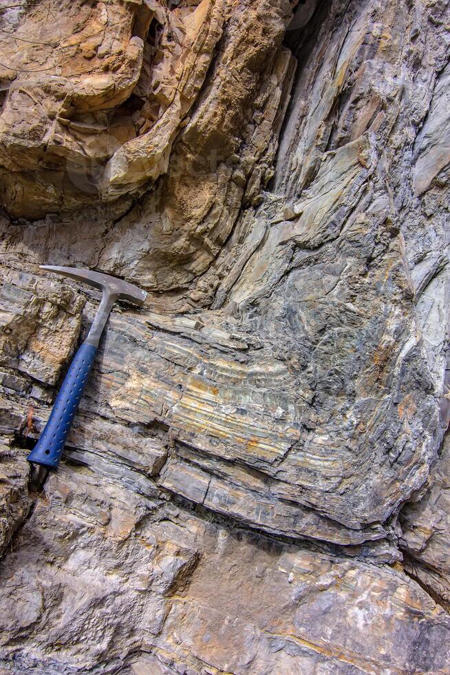 Geological Anticline Fold with Hammer. photo