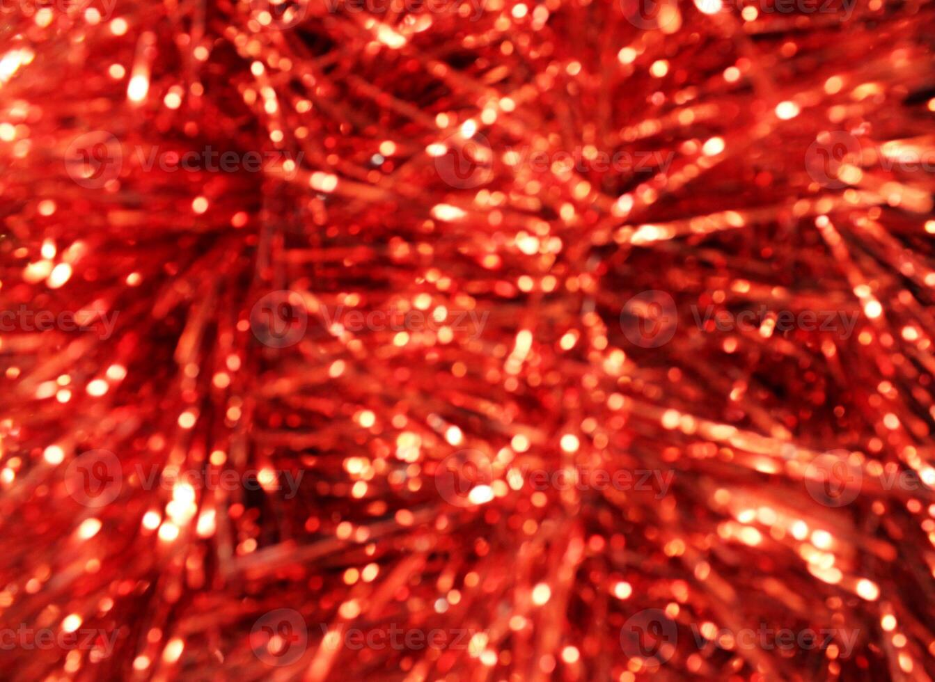 Red Christmas tinsel close-up. Red New Year Christmas Background photo