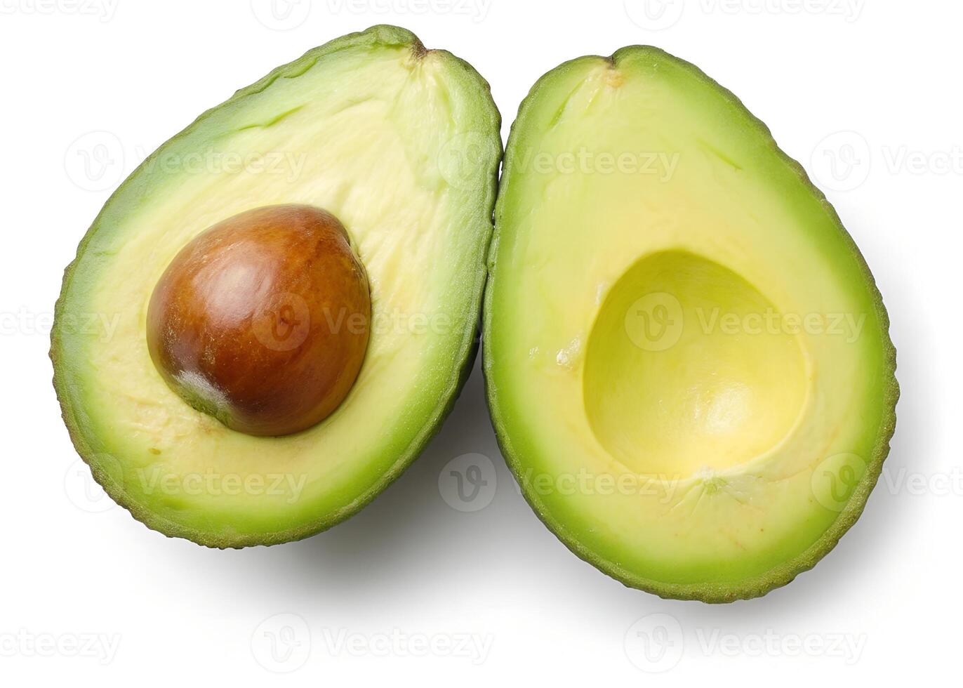 Fresh avocado halved with pit visible and empty cavity showing bright green flesh and skin isolated on white photo